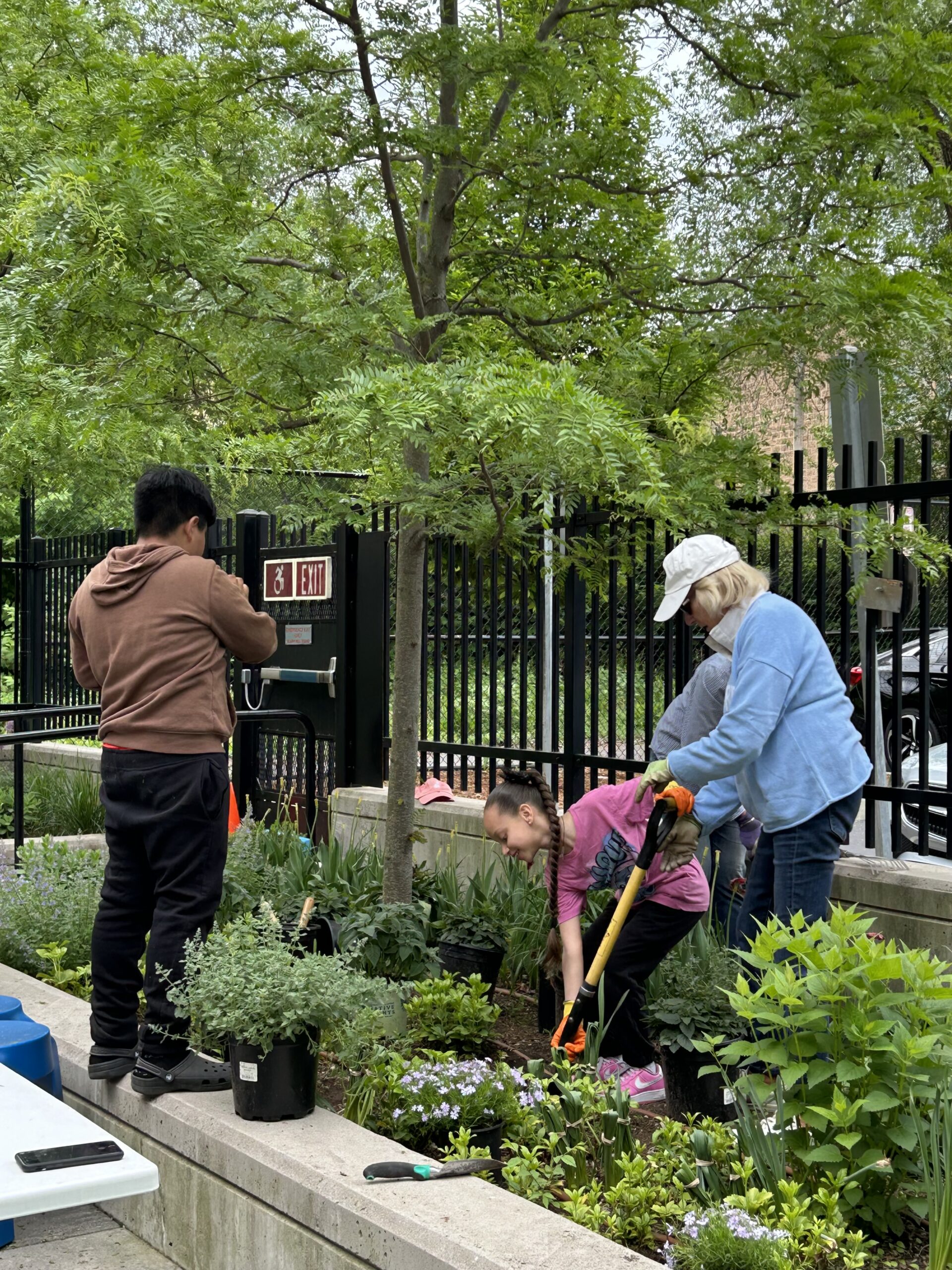 Members and children digging